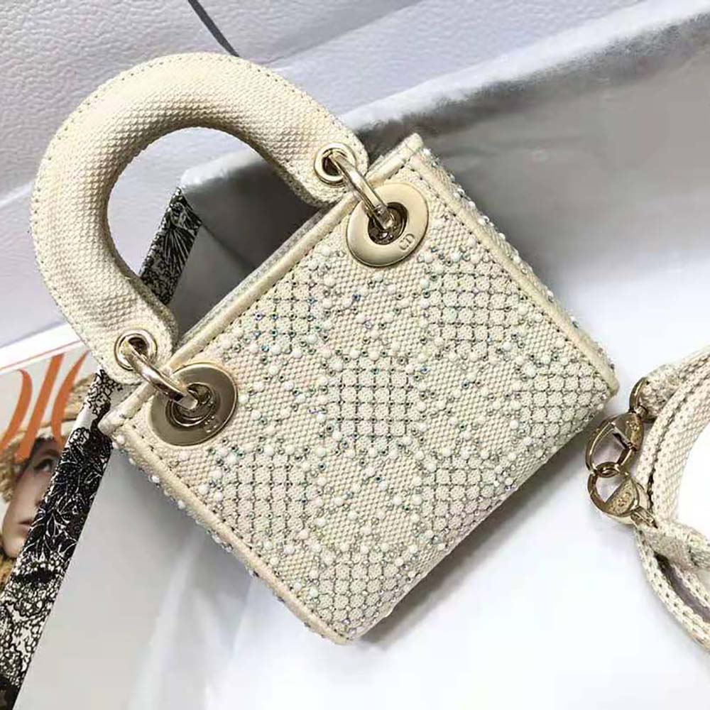 Side angle showing gold-tone hardware and silhouette of Dior Women Micro Lady Dior Bag