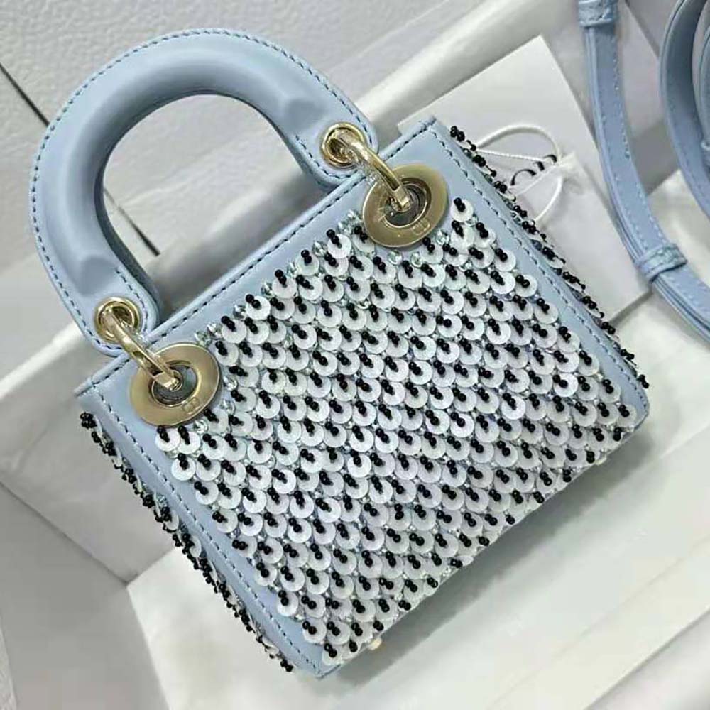 Side angle showing compact silhouette of Dior Women Micro Lady Dior Bag Horizon Blue