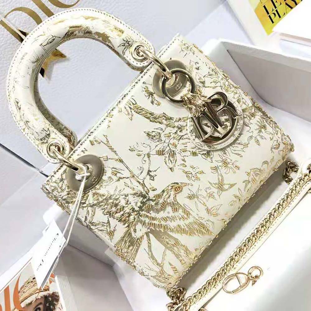 Close-up of gold-tone hardware and bead embroidery on Dior Mini Lady Dior Bag