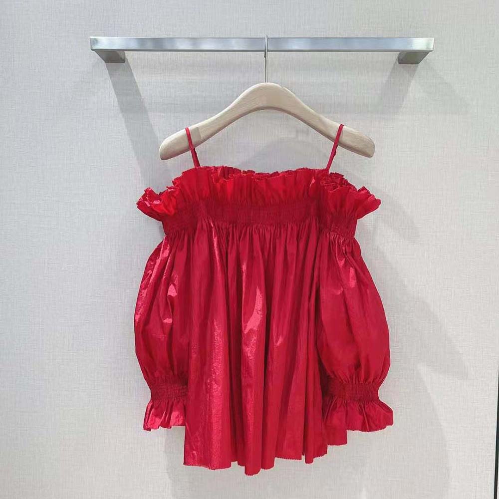 Side profile highlighting silhouette of Dior Women Off-the-Shoulder Smocked Top
