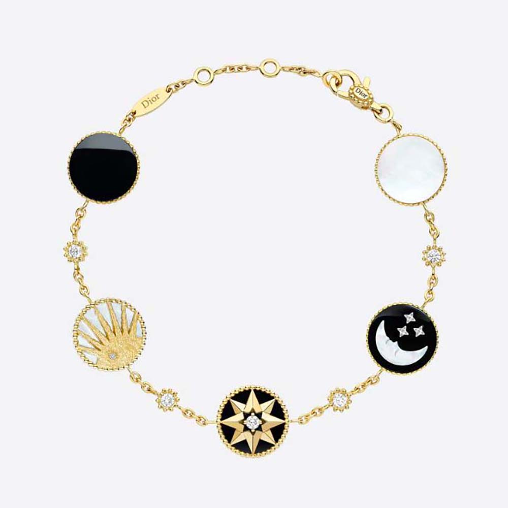 Close-up of Dior Women Rose Des Vents and Rose Céleste Bracelet gold charms