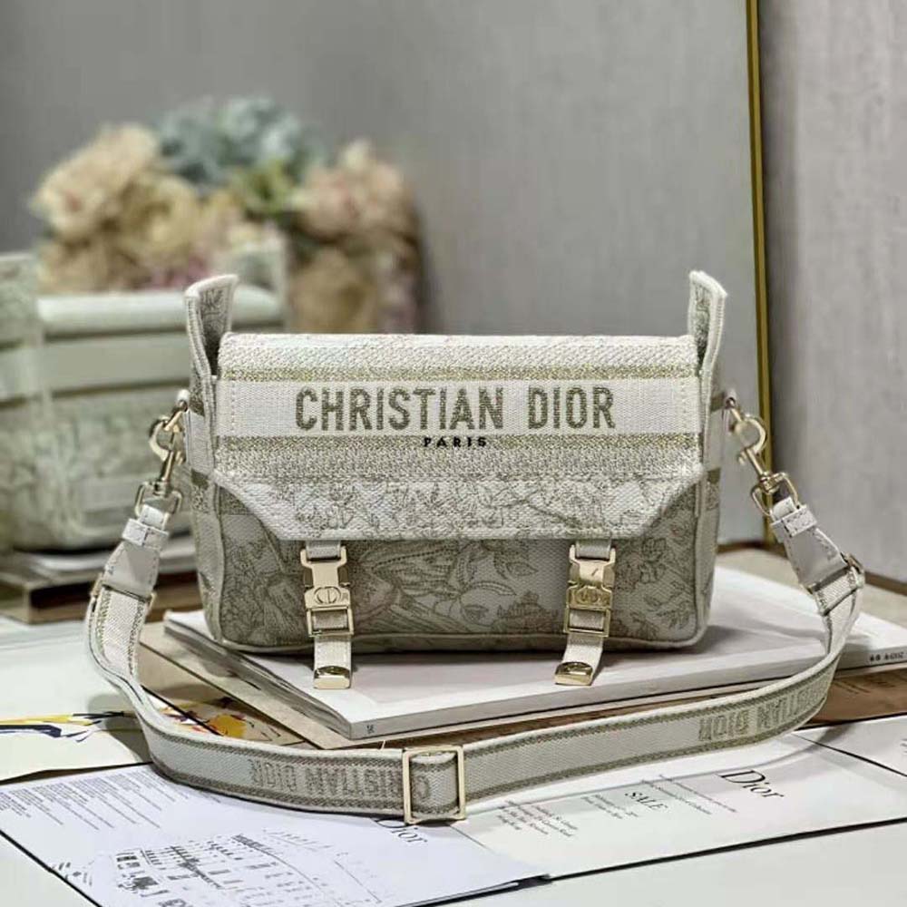 Close-up of gold-tone metallic thread embroidery on Dior Women Small Diorcamp Bag