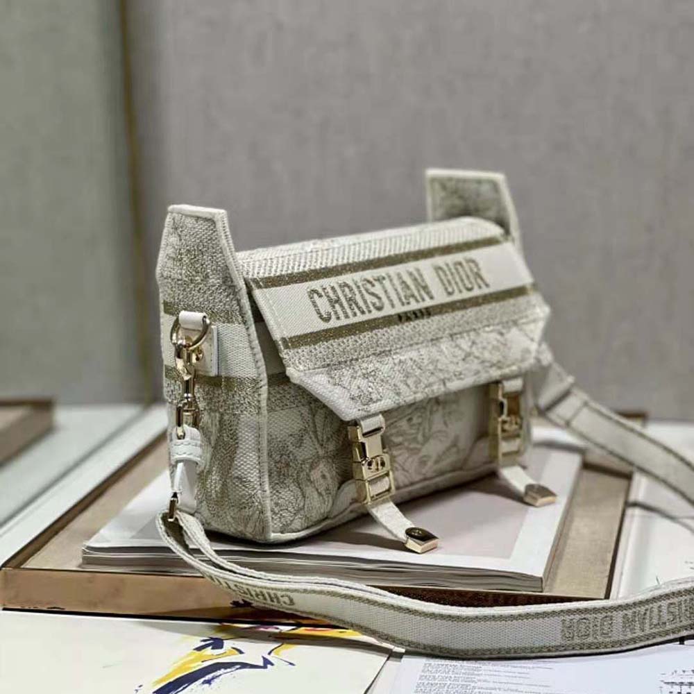 Side profile showing compact silhouette and gold hardware of Dior Women Small Diorcamp Bag