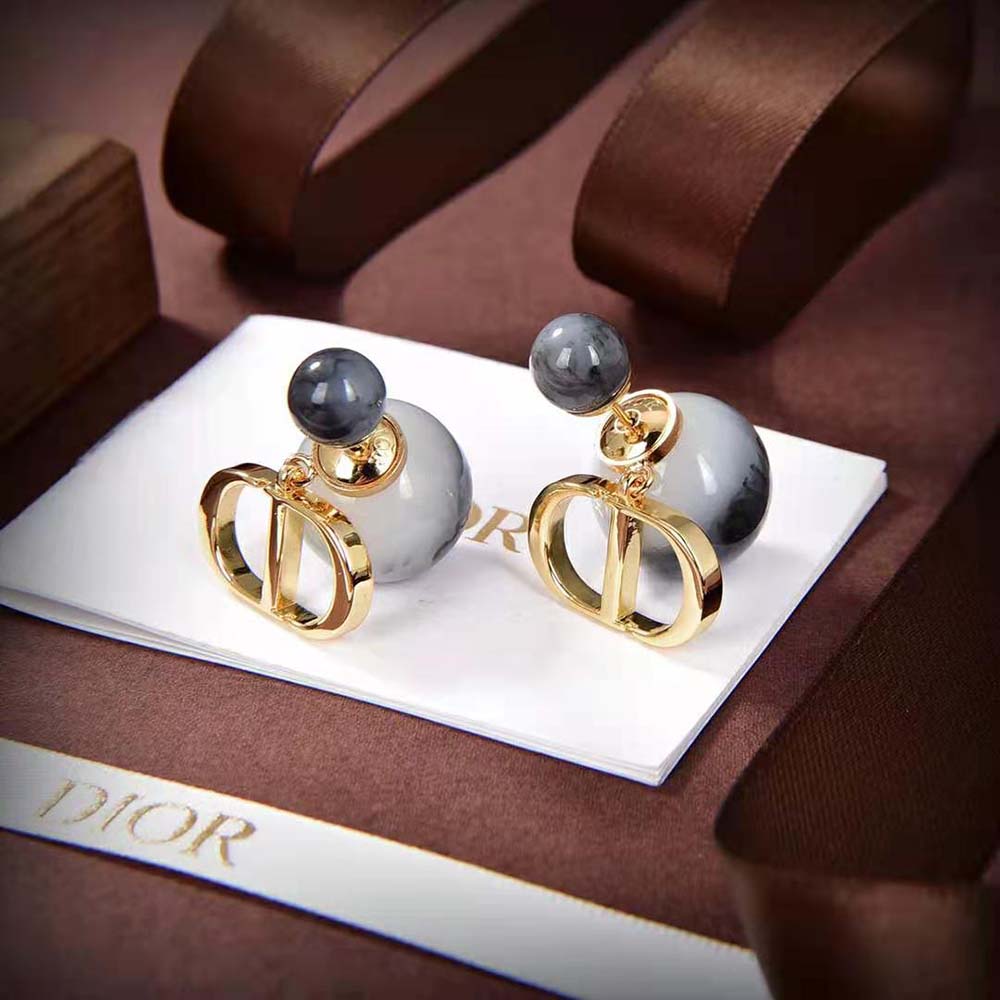Side angle showing double-sided silhouette of Dior Women Tribales Earrings