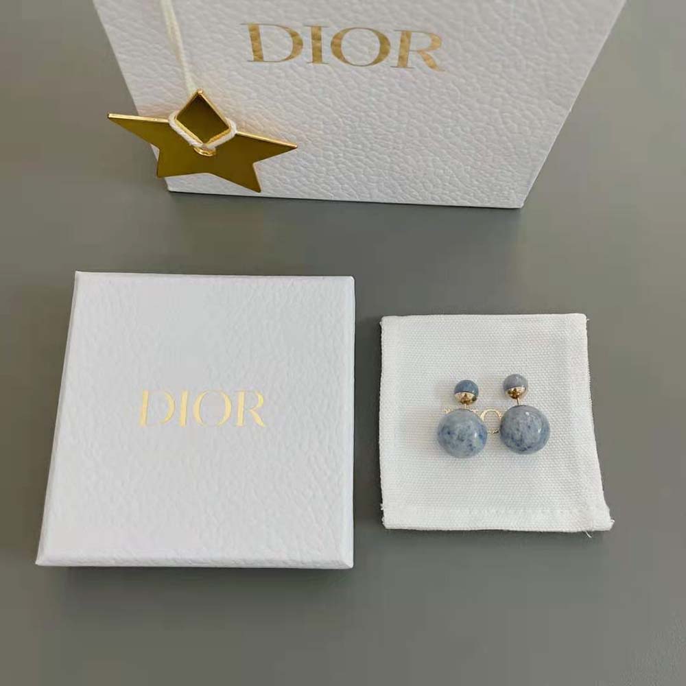 Close-up of blue stone and gold-finish detail on Dior Women Tribales Earrings