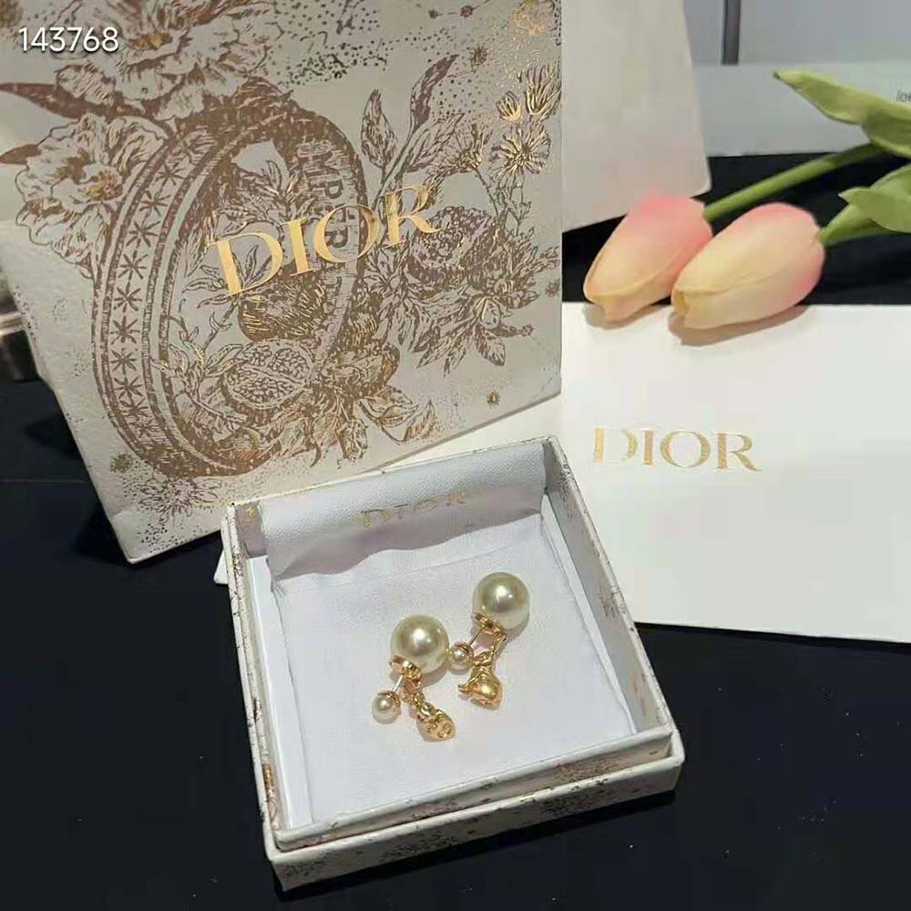 Close-up of white resin pearls on Dior Women Tribales Earrings
