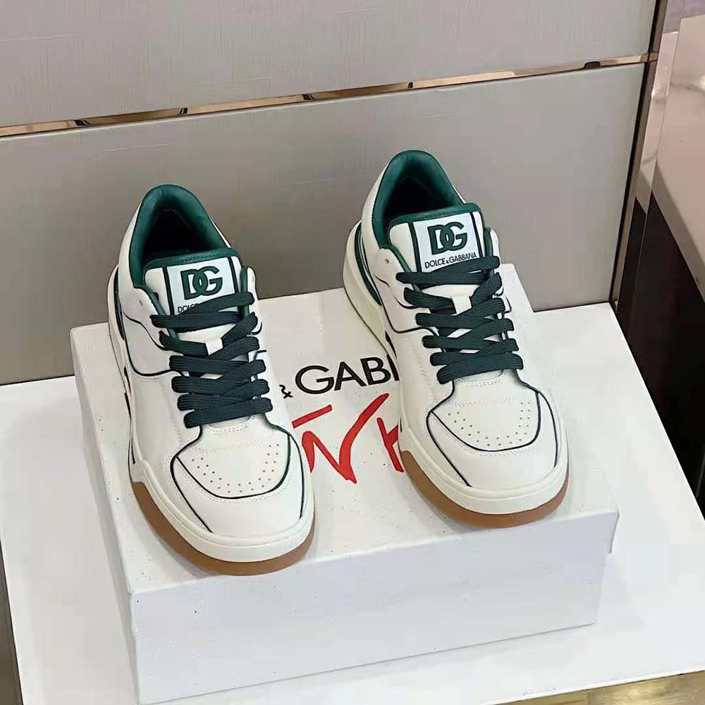 Close-up on green calfskin leather and D&G logo on sneakers