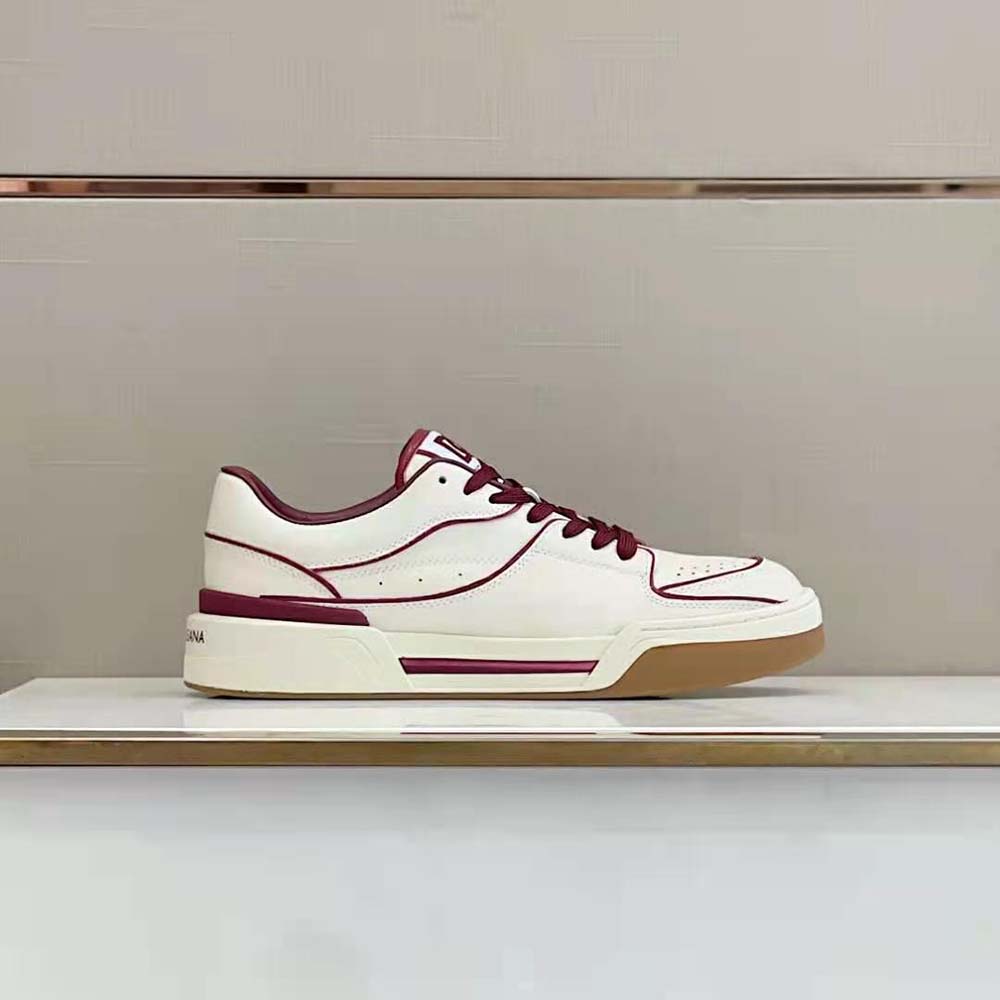 Close-up detail of red calfskin leather and D&G logo on New Roma Sneakers