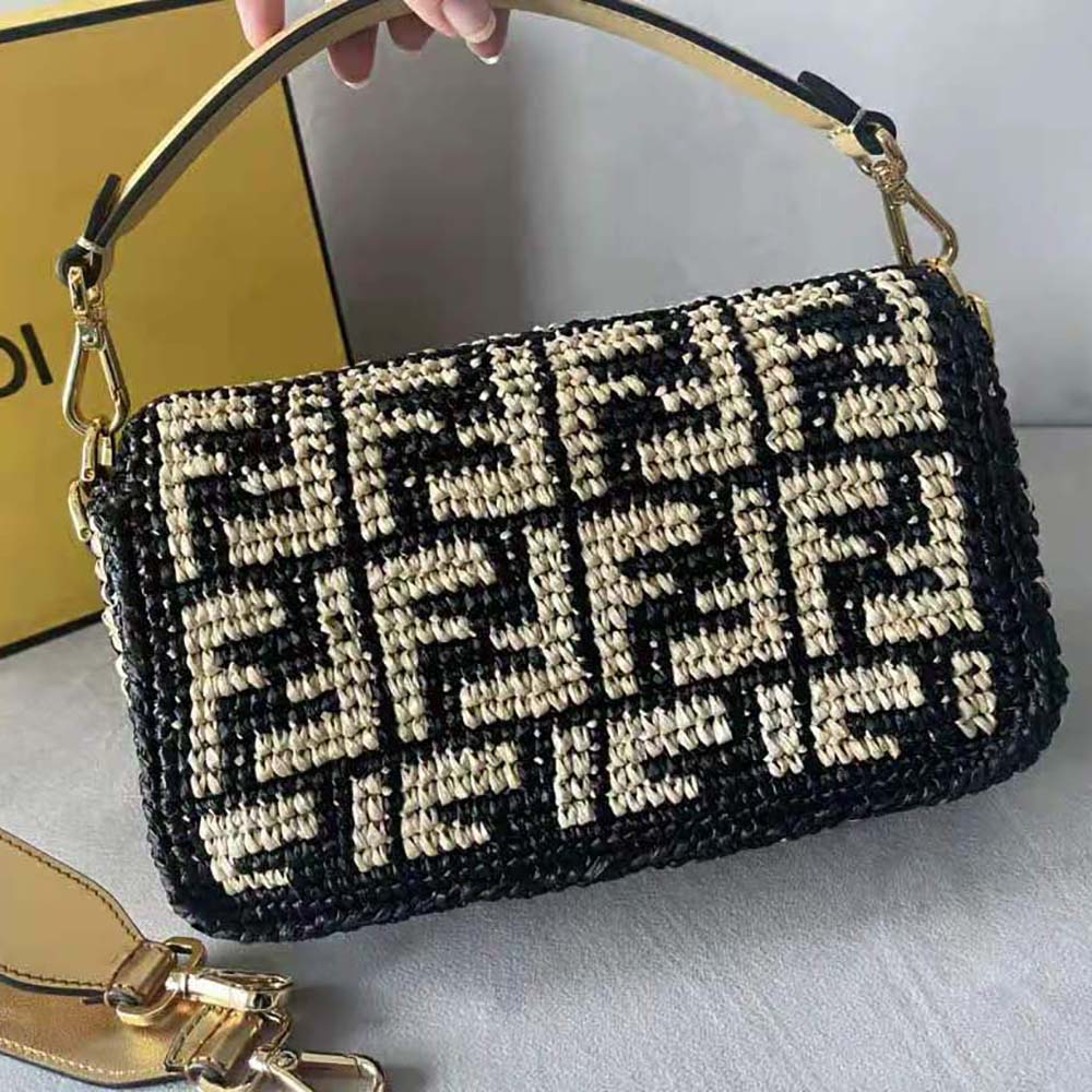 Side angle showing shoulder strap and gold hardware on Fendi Women Baguette Black Raffia Back