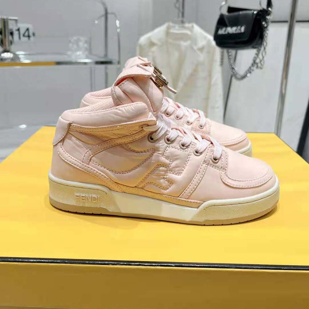Close-up of pink nylon texture and Fendi logo hardware detail