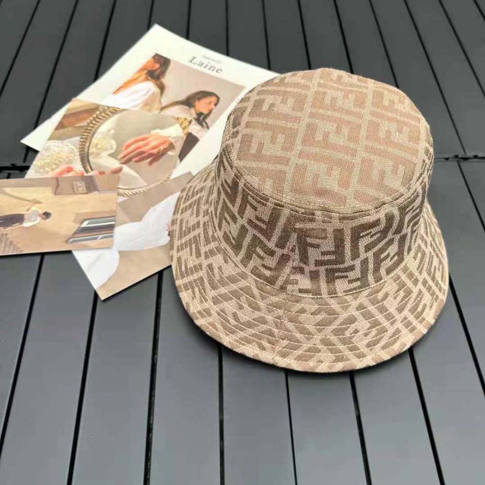 Close-up on adjustable strap and Fendi hardware on brown tech hat