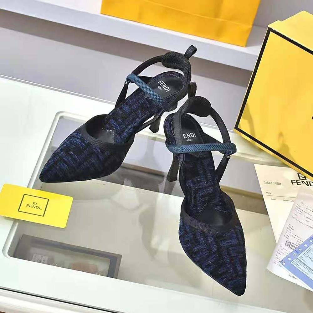Close-up of blue chenille and gold-tone hardware on Fendi slingbacks