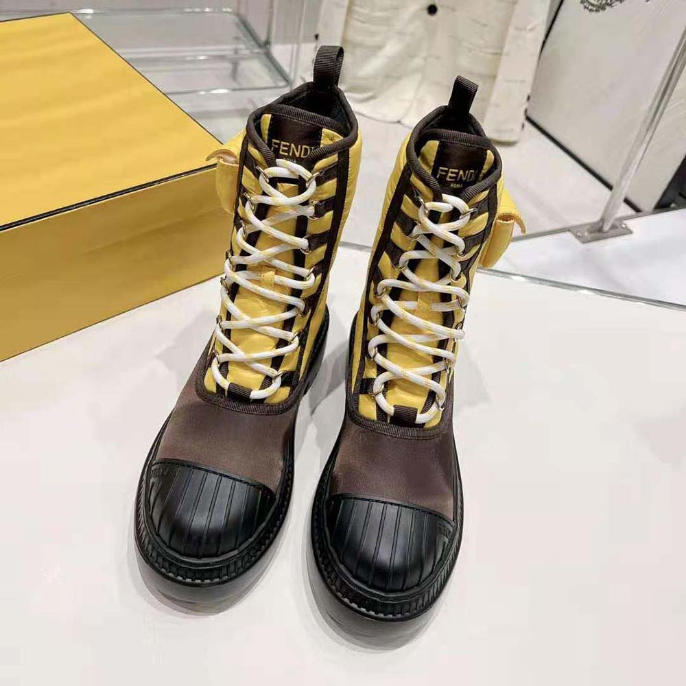 Front angle of Fendi Women Domino Yellow Nylon Biker Boots with zip closure