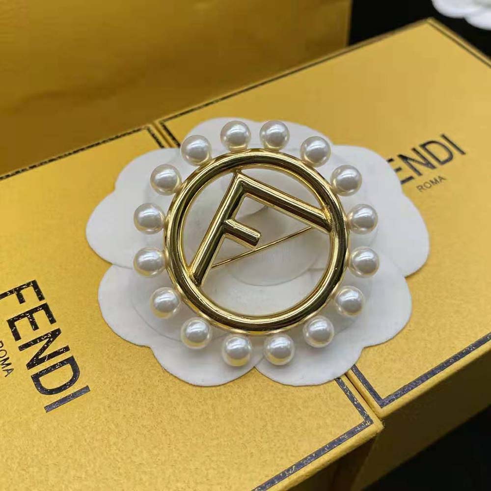 Fendi Women F Is Fendi Brooch Gold Colored Brooch pinned on a blazer lapel