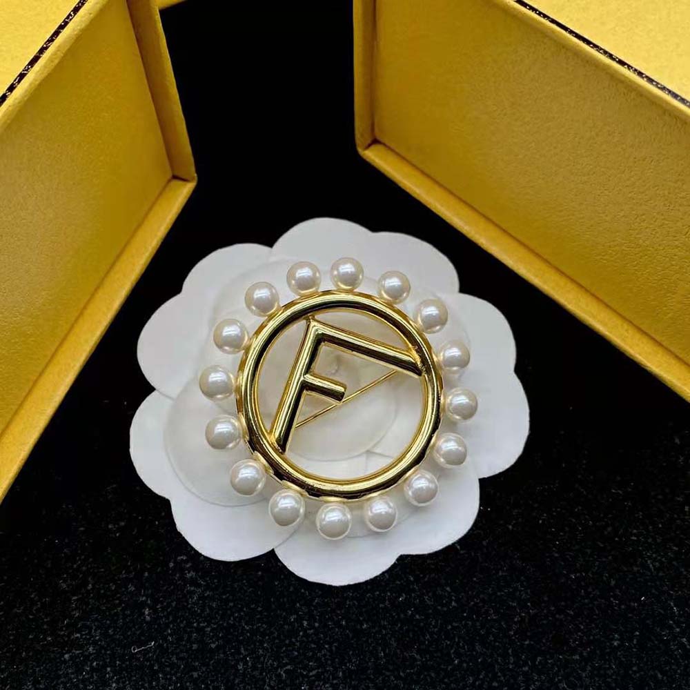 Side angle of Fendi Women F Is Fendi Brooch Gold Colored Brooch showcasing gold finish