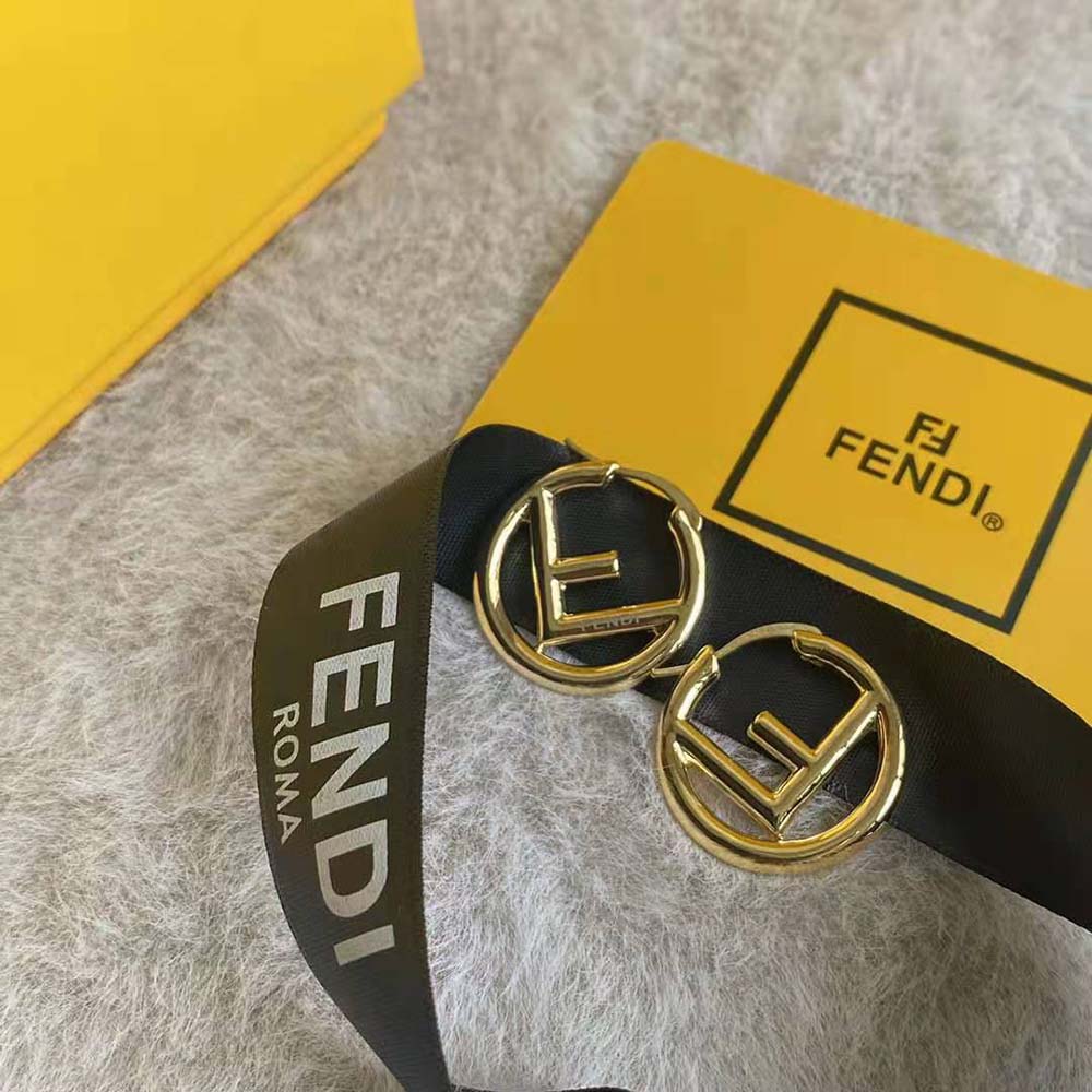 Close-up showing gold finish and clasp of Fendi Women F Is Fendi Earrings Gold-Colored