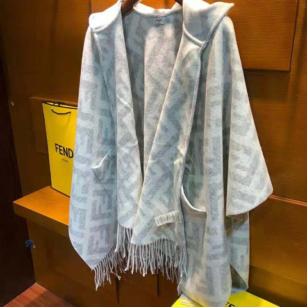 Close-up of soft cashmere fabric and subtle Fendi logo detail