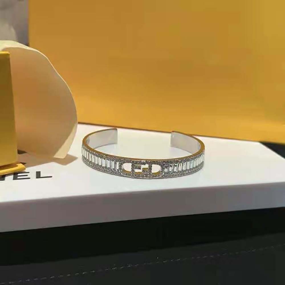 Side angle showing polished silver finish of Fendi Women O’Lock Bracelet