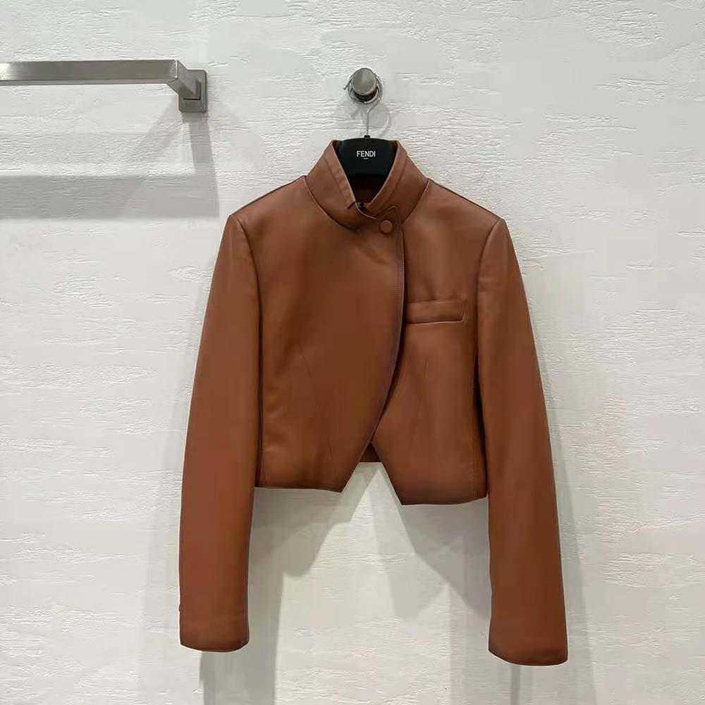 Close-up on gold-tone hardware and shaded leather detail of Fendi jacket