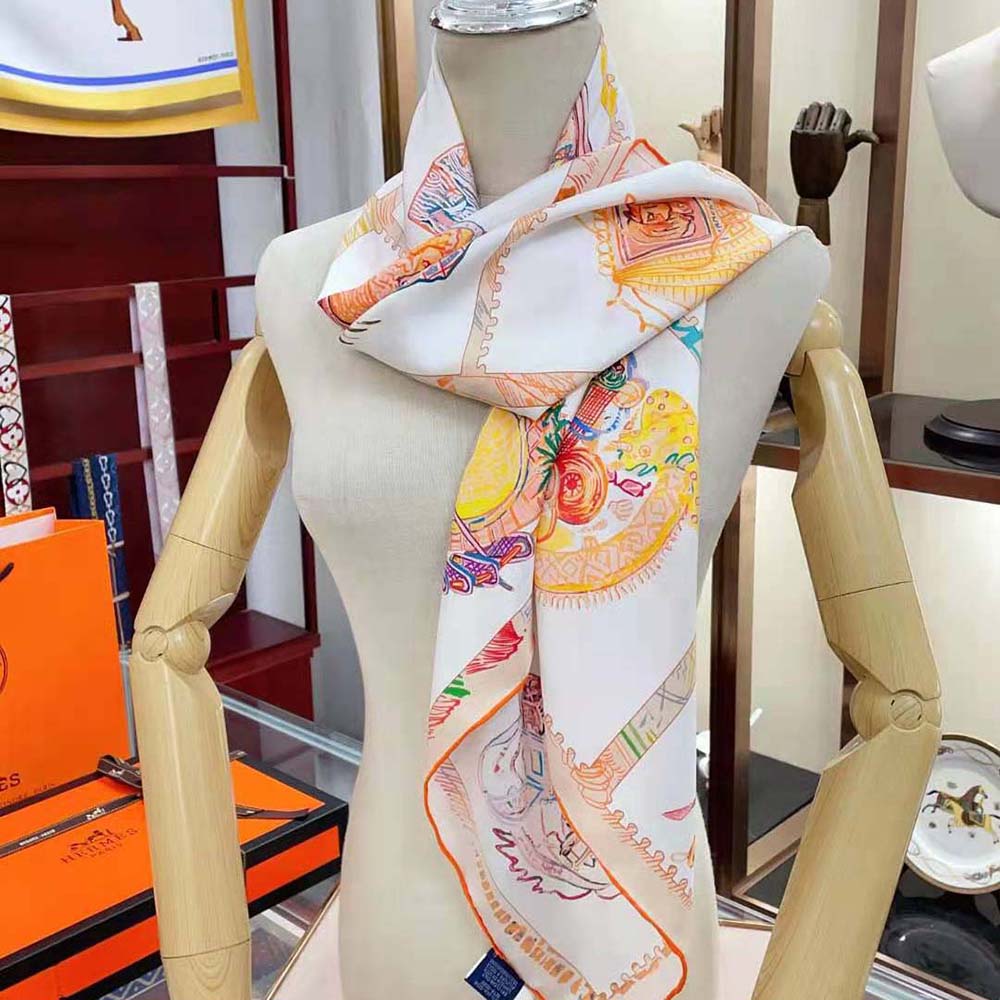 Close-up of hand-rolled edges on Hermes Women Chevaloscope Scarf 90