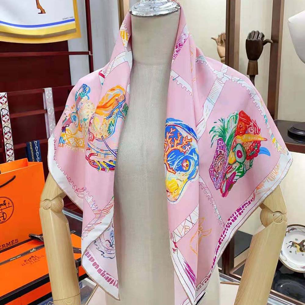 Styled flat lay of Hermes Women Chevaloscope Scarf 90 Silk Twill Pink