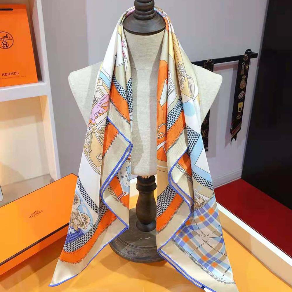 Styled detail showing vibrant orange color of Hermes Women Confort en Automobile Scarf
