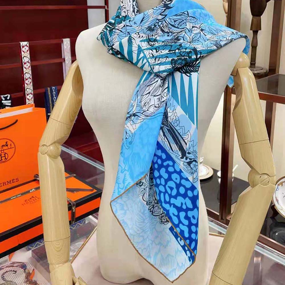 Close-up of hand-rolled edges on Hermes Women Jungle Love Scarf in blue
