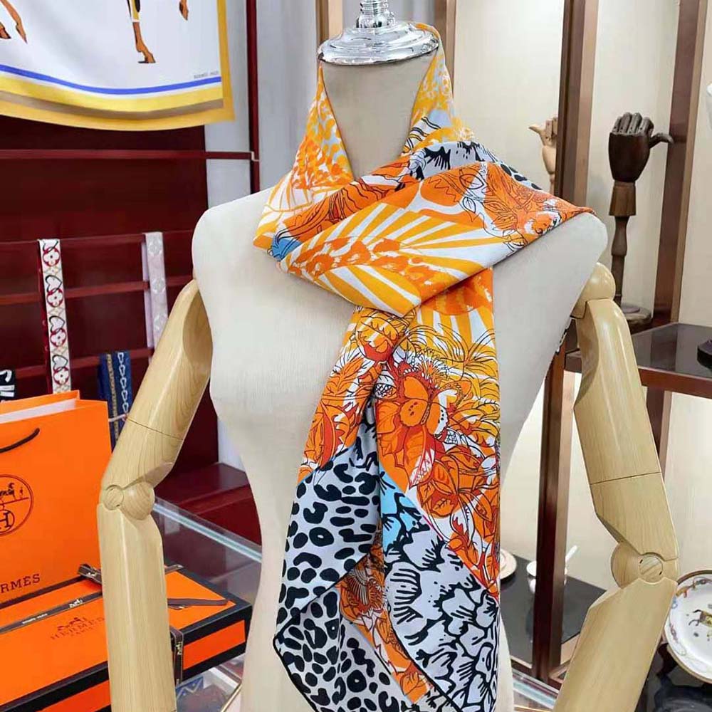 Close-up of hand-rolled edges on Hermes Women Jungle Love Scarf in red silk