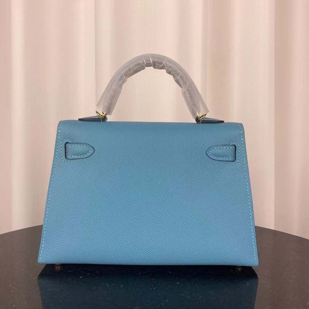 Side profile showing structured shape of Hermes Women Kelly Bag 20 blue bag