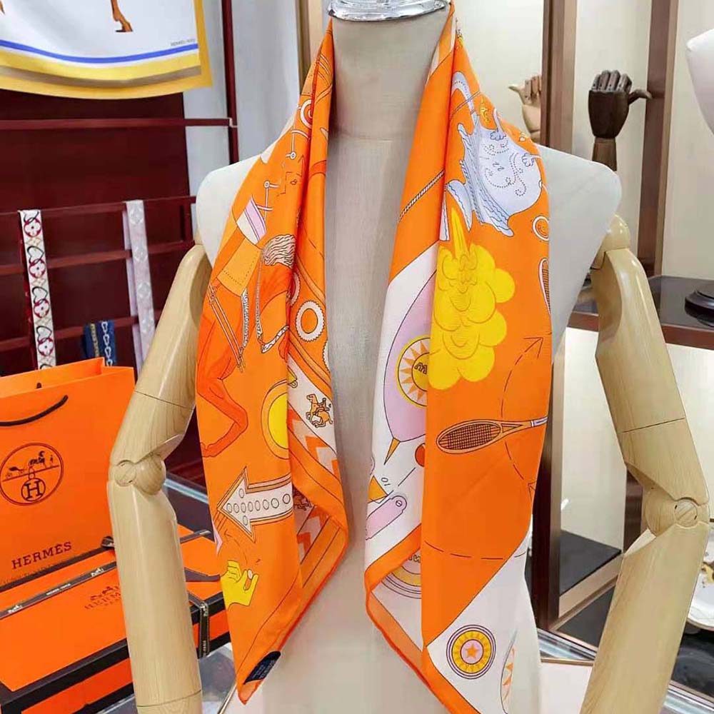 Hermes Women Tea for Two Scarf 90 orange folded with vibrant colours