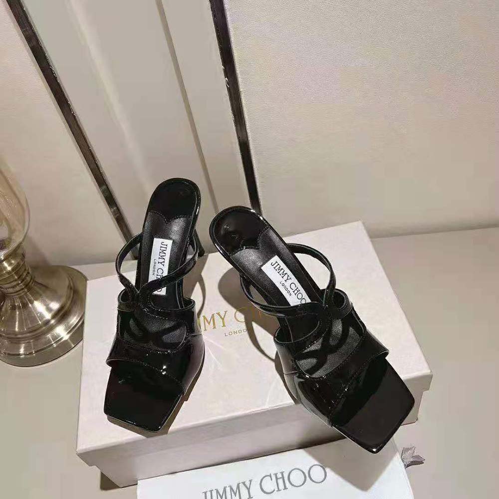 Close-up on pointed toe and gold logo of Jimmy Choo Anise 95 mules