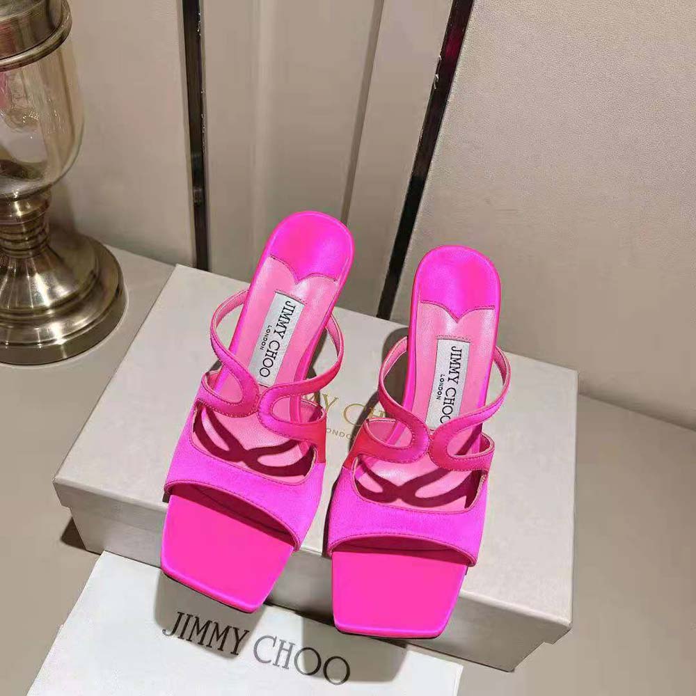 Close-up of rose satin and gold logo on Jimmy Choo Anise 95 mules