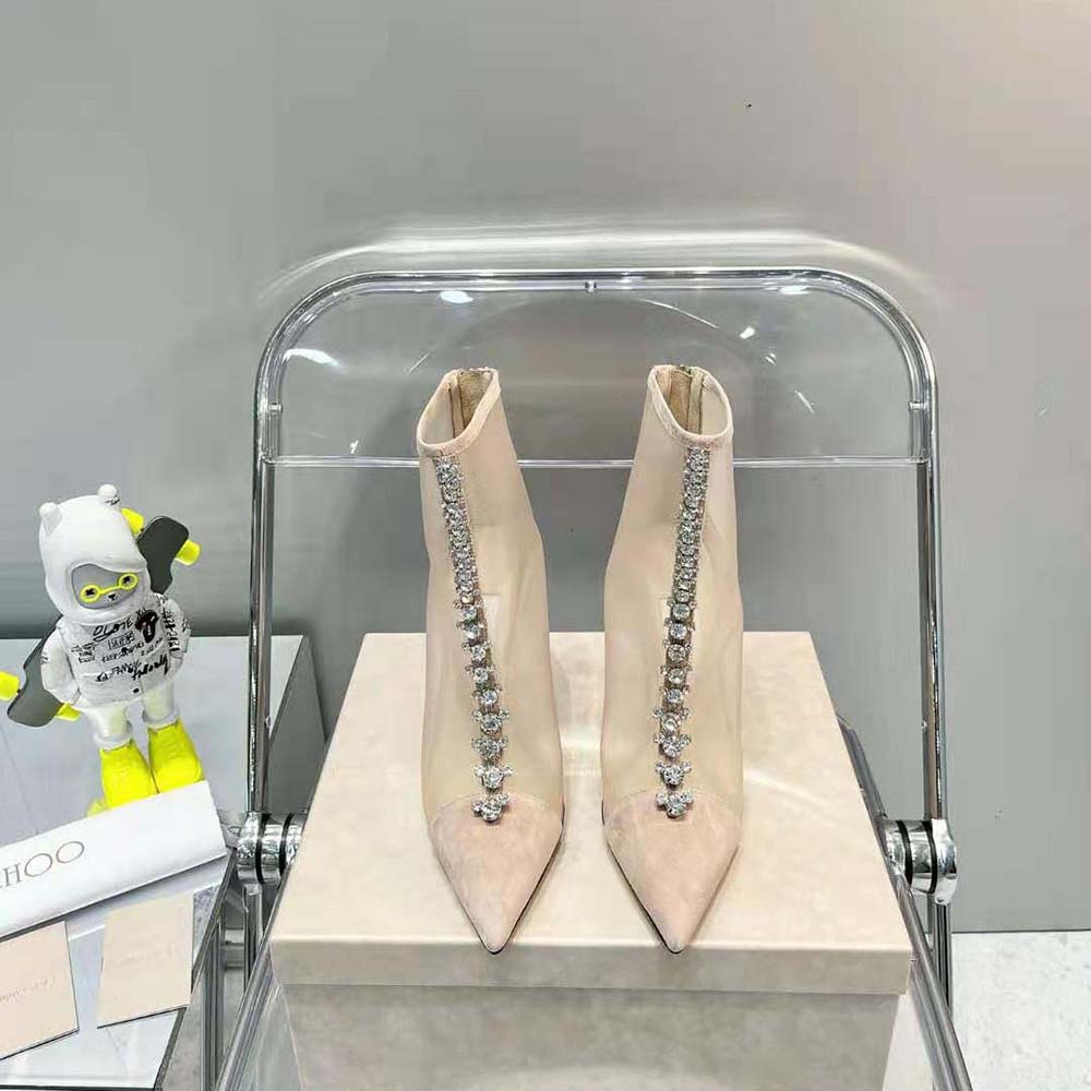 Close-up on ballet pink suede and mesh texture of Jimmy Choo boot