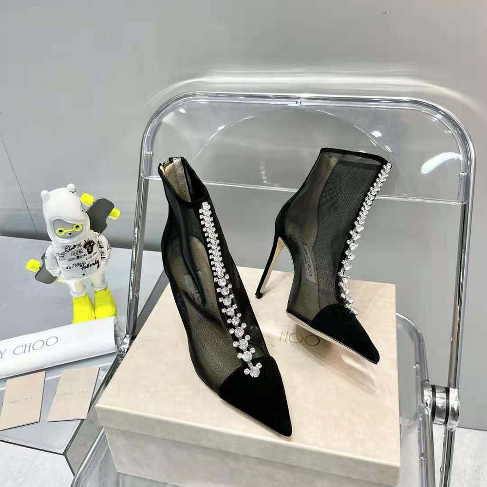Side profile showing sculpted heel of Jimmy Choo Women Bing Boot 100