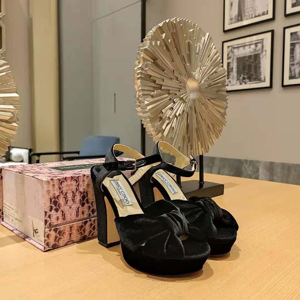 Front angle showcasing platform and ankle strap of Jimmy Choo Heloise sandals