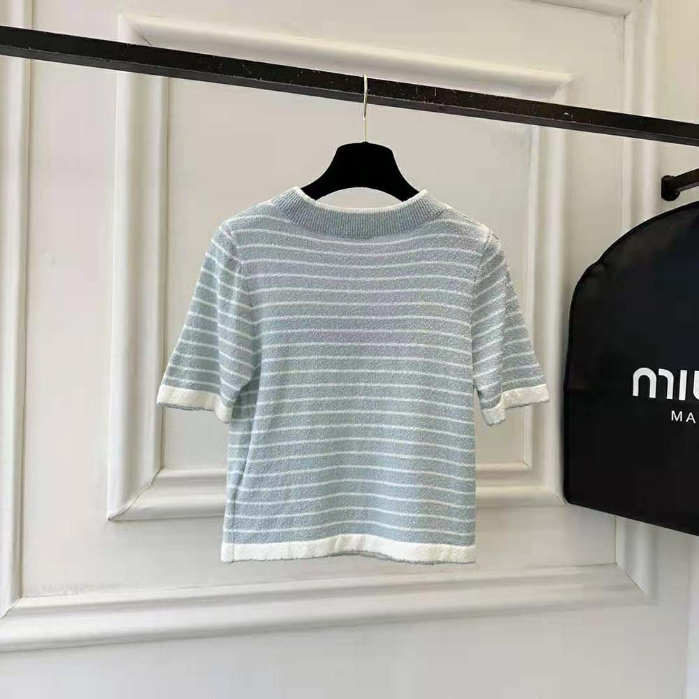Side profile showing relaxed fit of Miu Miu Women Bouclé Cotton Crew-Neck Sweater