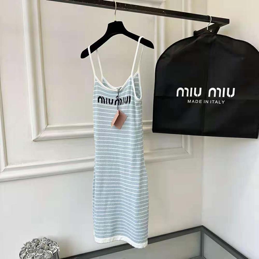 Side angle showing silhouette and zip closure of Miu Miu mini-dress