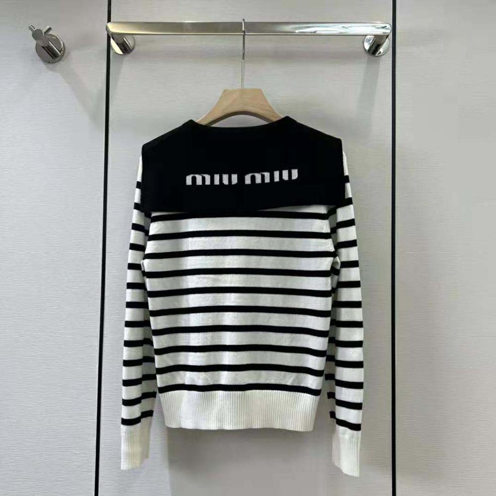 Side angle showing slim fit and ribbed cuffs of Miu Miu Women Cashmere Cardigan White