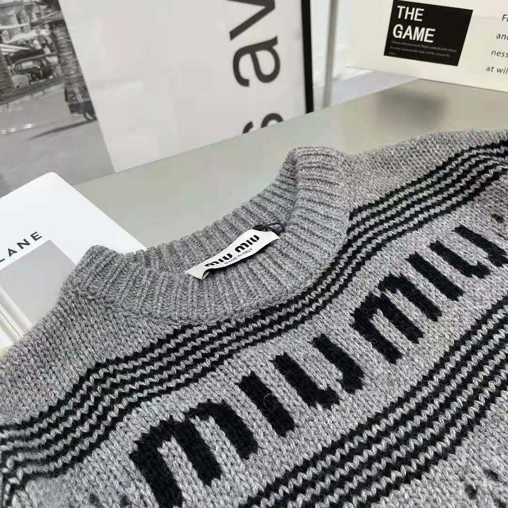 Side angle showing relaxed fit of Miu Miu Women Cashmere Crew-Neck Sweater gray