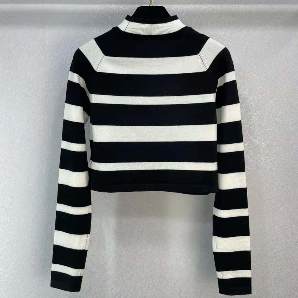 Side angle showing slim fit silhouette of Miu Miu Women Cashmere and Silk Turtleneck Sweater