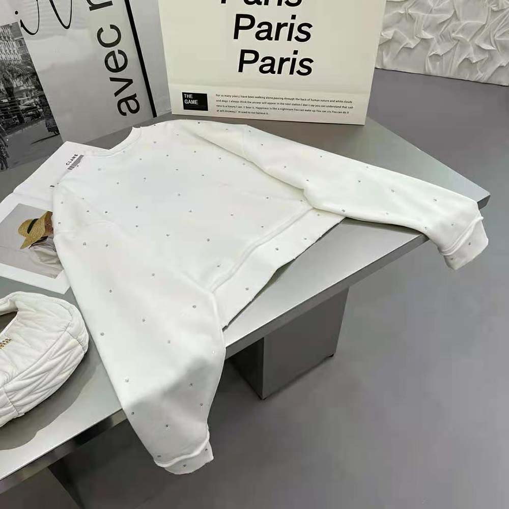 Side profile showing relaxed fit of Miu Miu White Crystal Sweatshirt