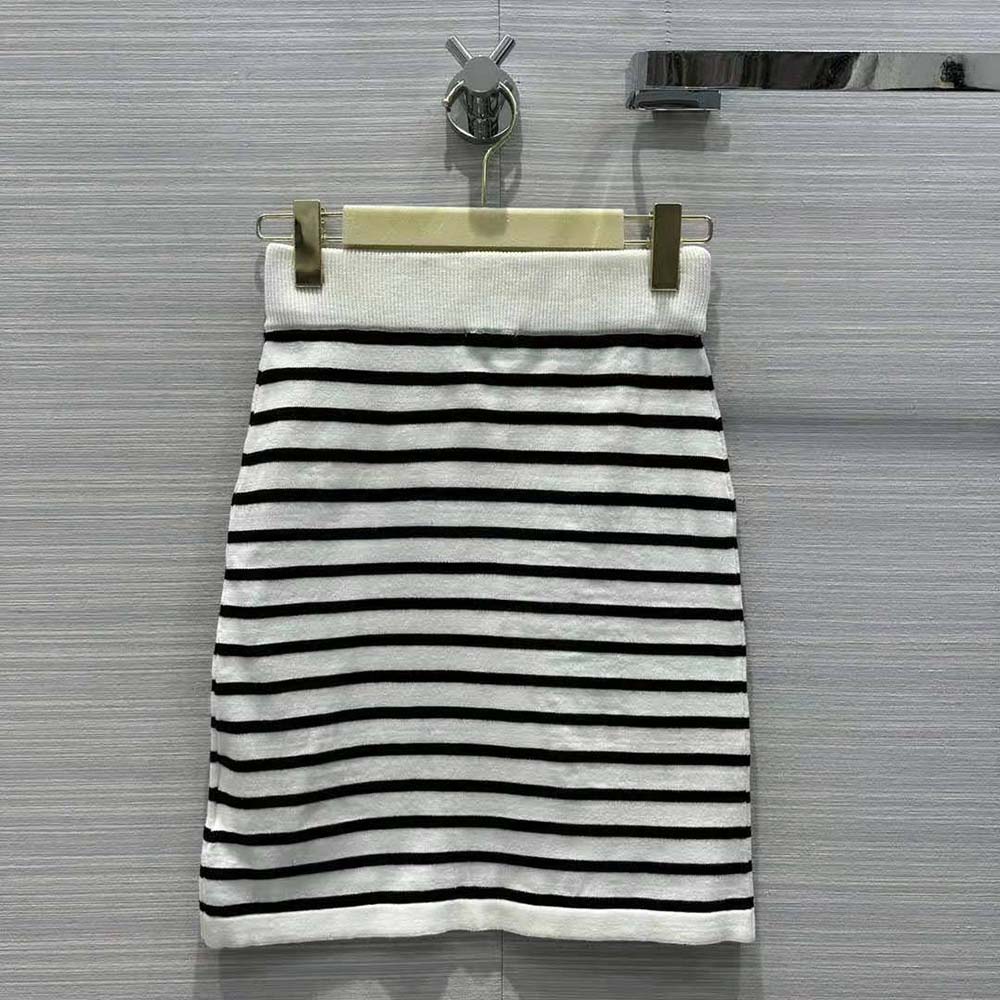 Side angle showing silhouette of Miu Miu Women Cotton Miniskirt Black