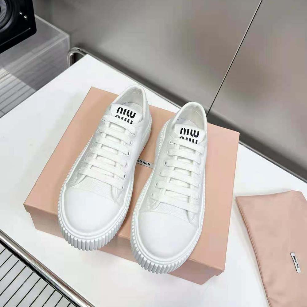 Close-up of white denim upper and embossed logo on Miu Miu Women Denim Sneakers EVA Sole with Logo-White