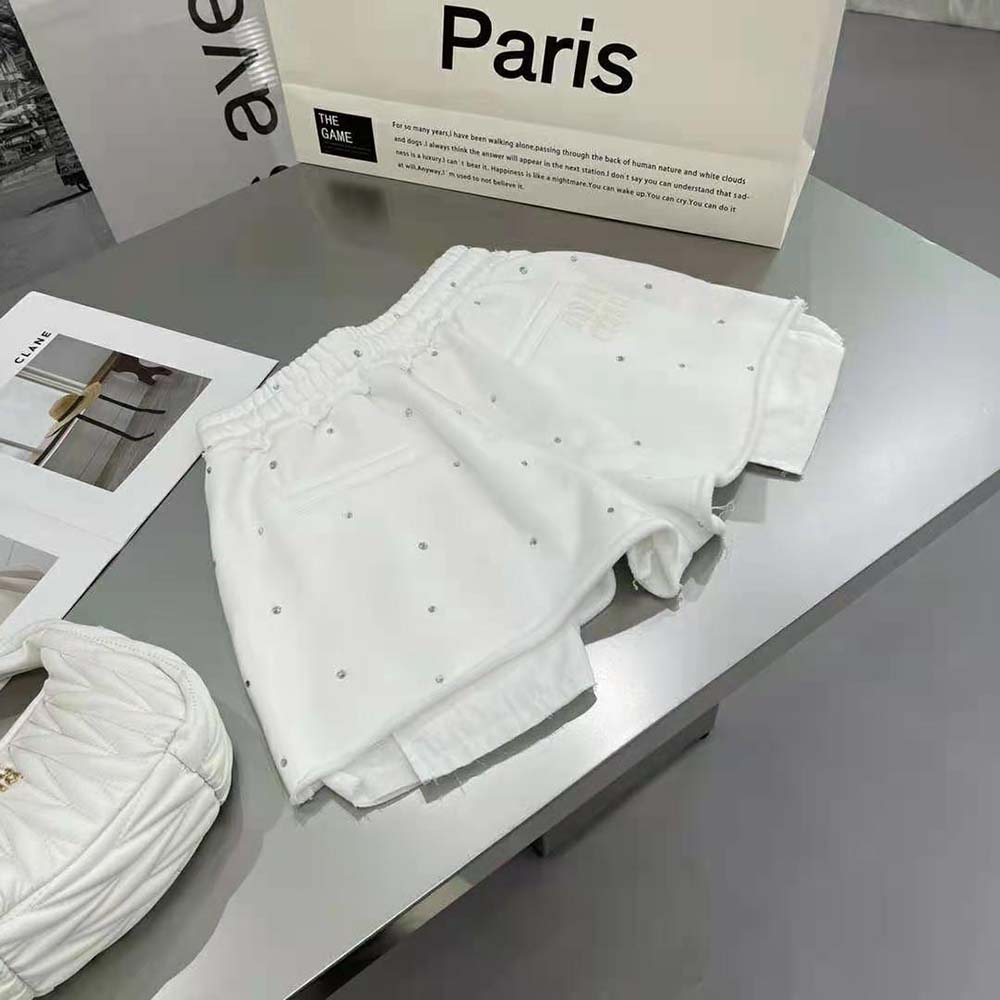 Side angle of Miu Miu Women Embroidered Cotton Shorts showcasing silhouette