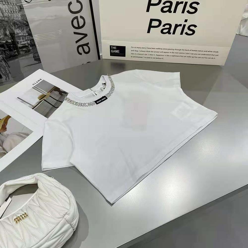 Side angle showing fit and silhouette of Miu Miu Women White T-shirt