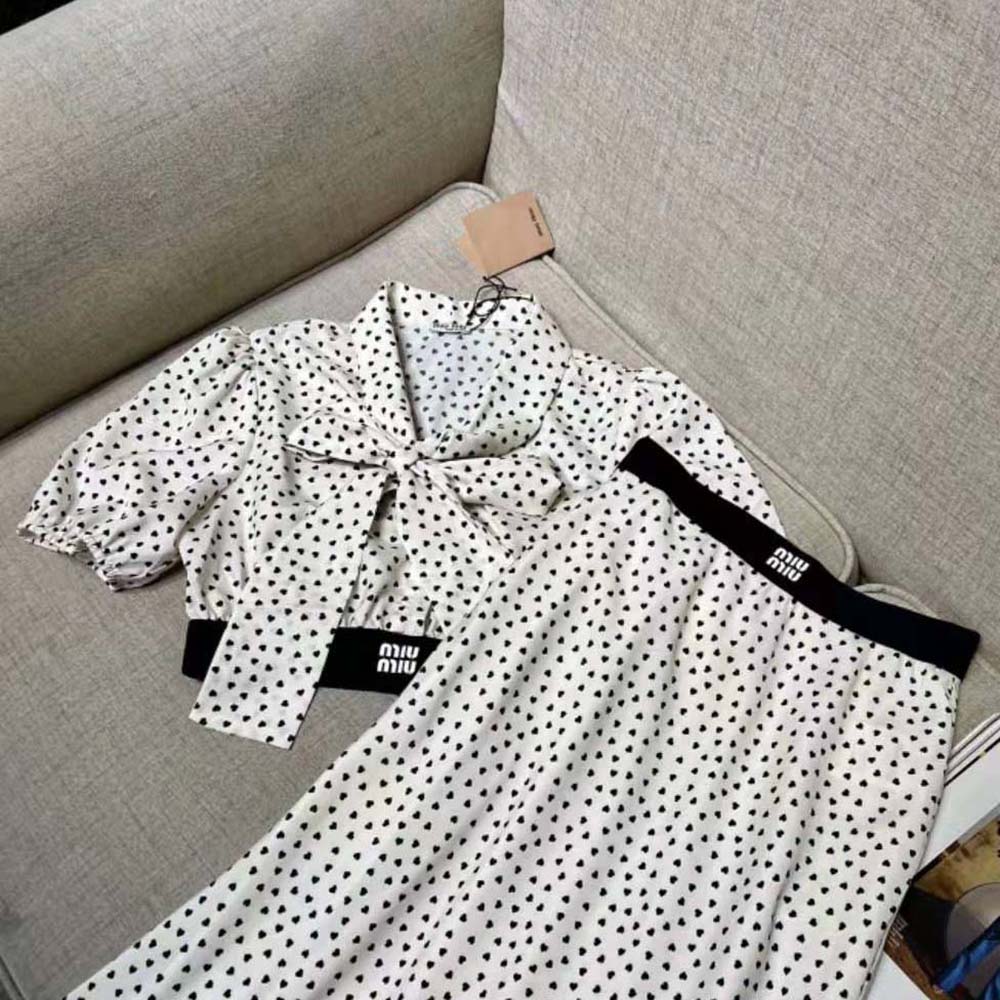 Side angle showing relaxed fit of Miu Miu Women Heart-Print Crepe De Chine Top