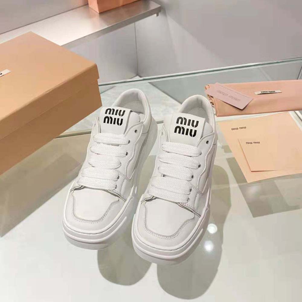 Close-up on smooth calf leather and laces of Miu Miu Women Leather Sneakers-White