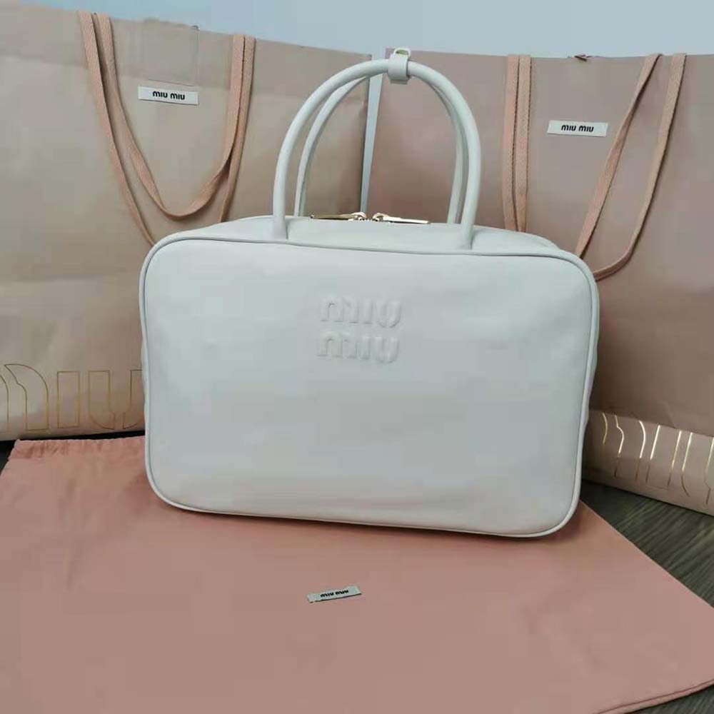 Close-up of gold hardware on Miu Miu Women Leather Top-Handle Bag-White