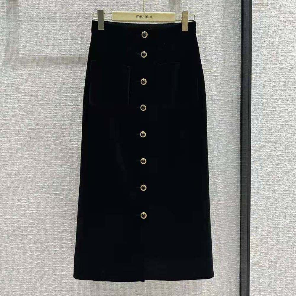 Close-up of jacquard logo detail on Miu Miu velvet skirt waistband