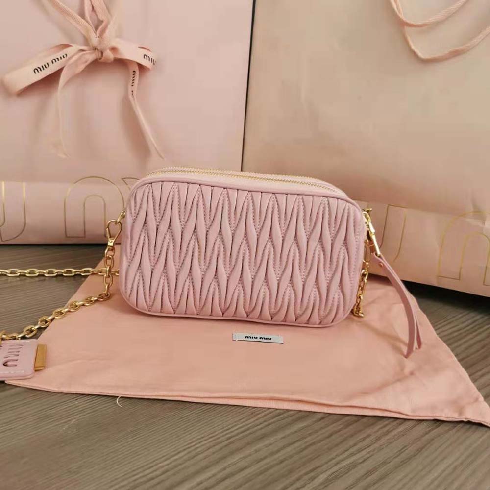 Side angle showing silver hardware and compact silhouette of Miu Miu mini-bag